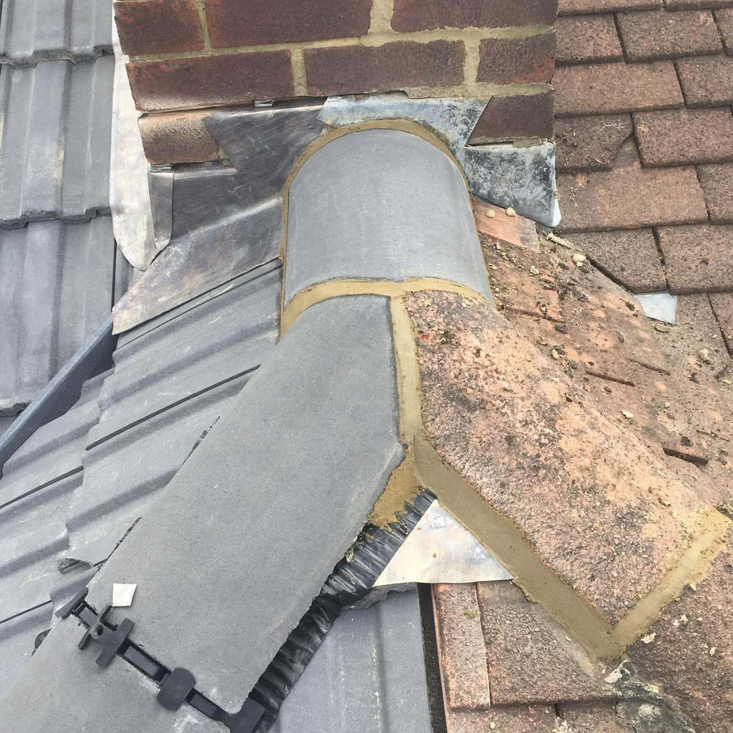 Chimney flashing and transitions repaired and dressed after specialist works
