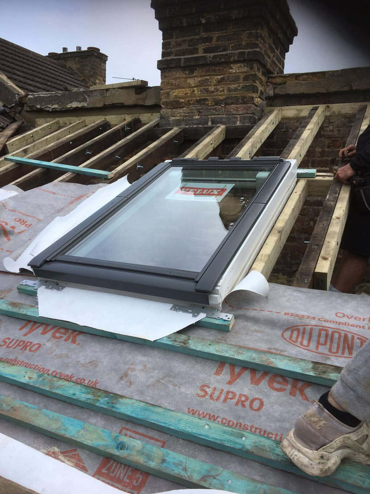 Roof with weathering and visible defects before re-roofing works