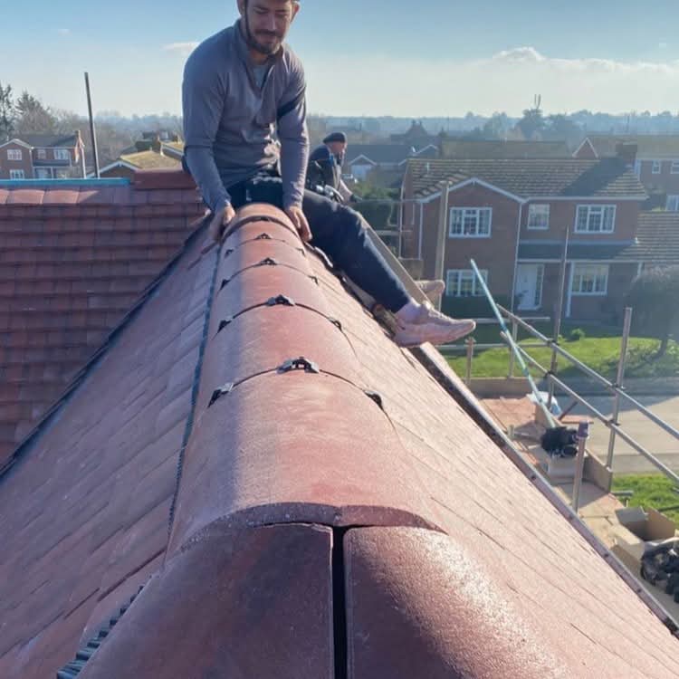 Roof team working ridge lines safely with secure fall control and structured access